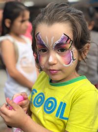 Portrait of girl with painted face
