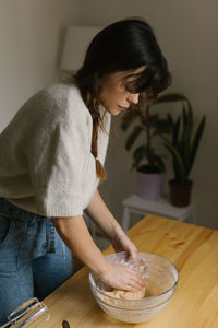 Young woman making christmas cookies