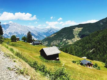 Scenic view of landscape and mountains against sky