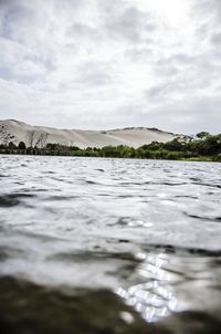 Scenic view of sea against cloudy sky