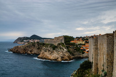 Scenic view of sea against cloudy sky