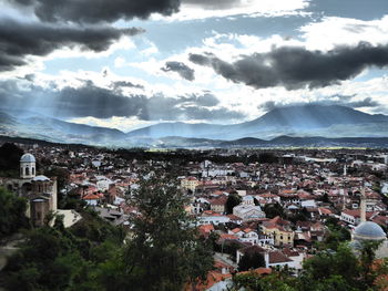 Houses in town against sky