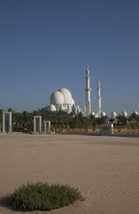 Built structure on beach against clear sky