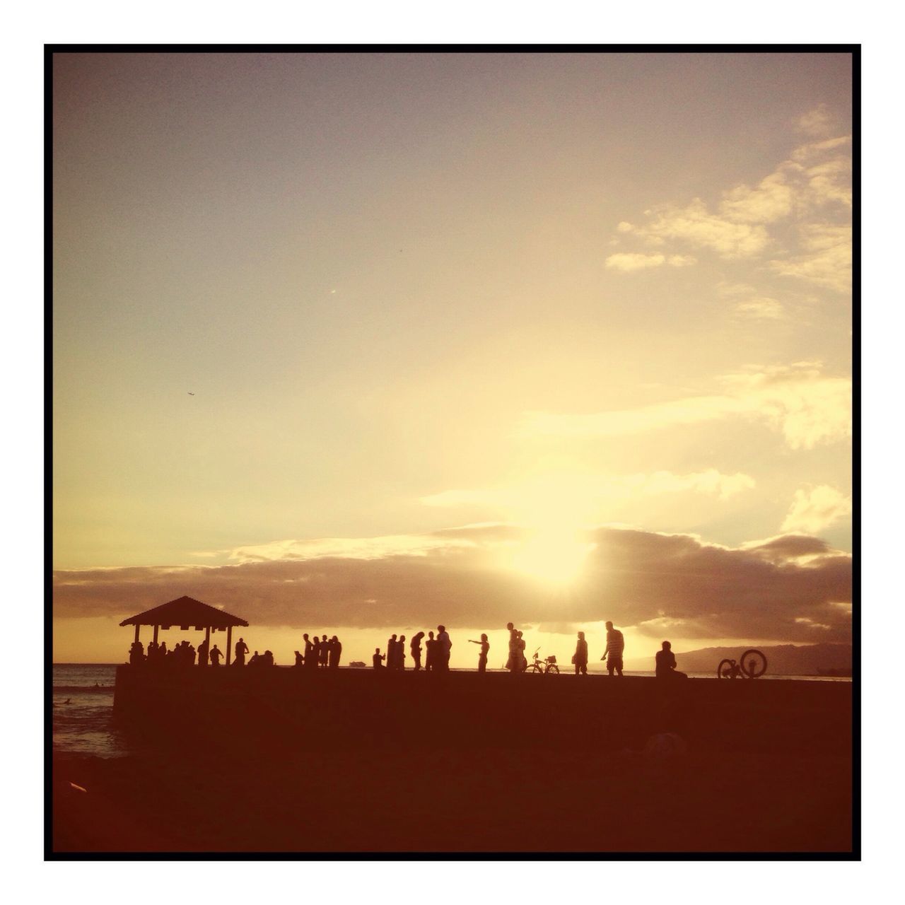 transfer print, sunset, large group of people, sky, auto post production filter, lifestyles, leisure activity, silhouette, men, person, scenics, beauty in nature, cloud - sky, tranquil scene, mixed age range, beach, nature, tranquility, enjoyment