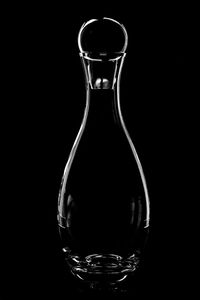 Close-up of empty glass against black background
