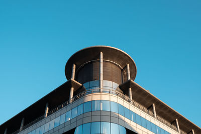 Low angle view of building against clear blue sky