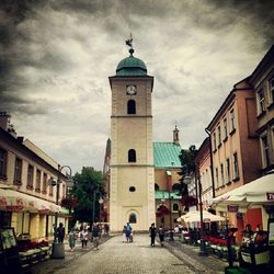 View of buildings against cloudy sky