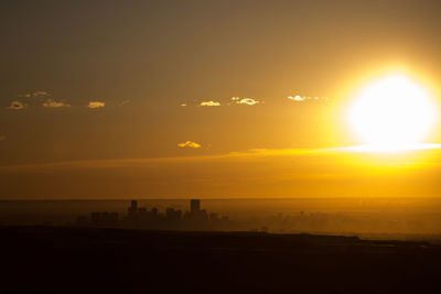 Scenic view of silhouette landscape against sky during sunset