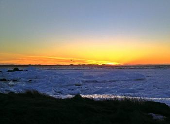 Scenic view of sea at sunset