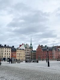 Buildings in city against sky