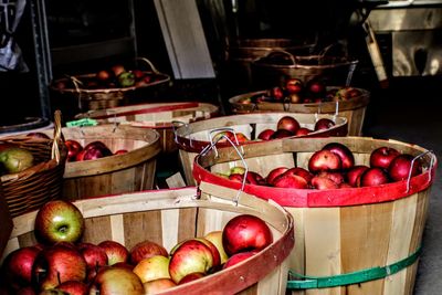 Various fruits in basket for sale at market stall