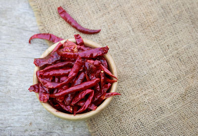 High angle view of red chili pepper on table