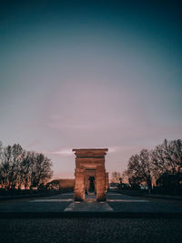 Built structure against sky at sunset