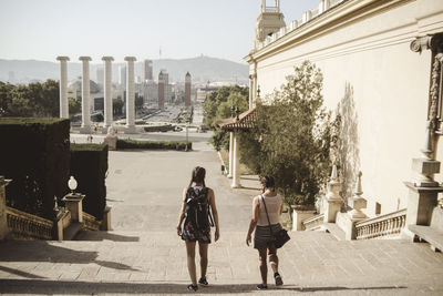 Rear view of women walking in park