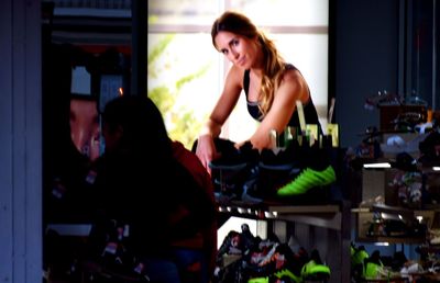 Portrait of young woman looking at store