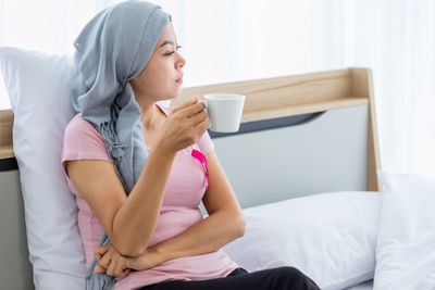 Woman holding coffee cup