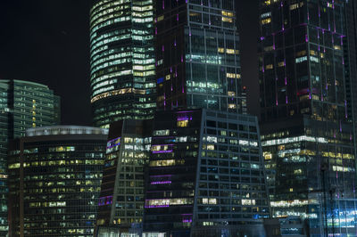 Low angle view of illuminated buildings at night