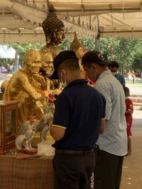 Rear view of people at temple