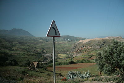 Scenic view of field against clear blue sky