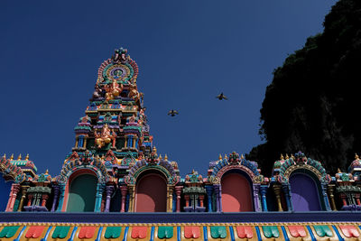 Low angle view of building against blue sky