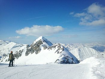 Tourists on snow covered landscape