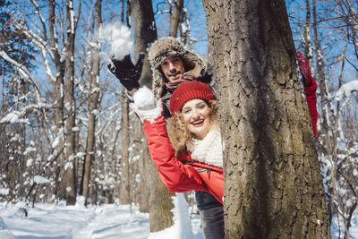 Portrait of smiling woman in snow