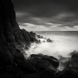 Scenic view of sea against cloudy sky