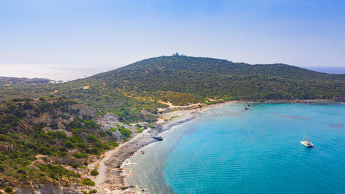 High angle view of sea and mountains against sky