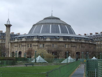 View of buildings against cloudy sky