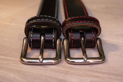 Close-up of belts on table