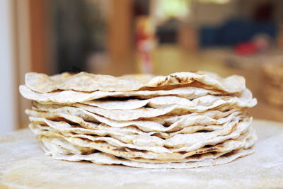 Close-up of flat breads on table