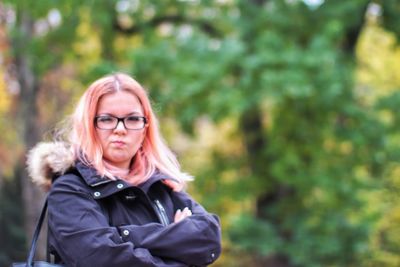 Portrait of woman in park during winter