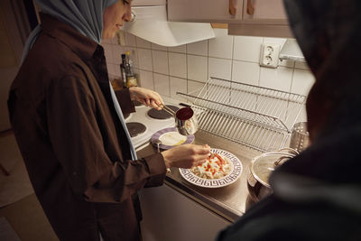 Women preparing eid al-fitr at home