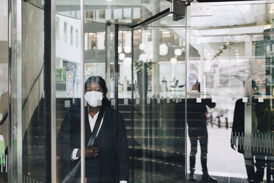 Reflection of people on glass window