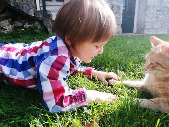 Boy with horse in grass