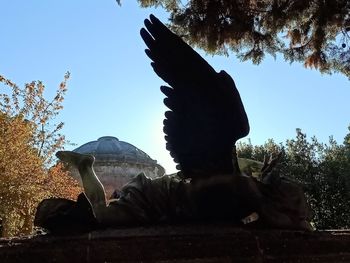 Low angle view of statue against clear sky