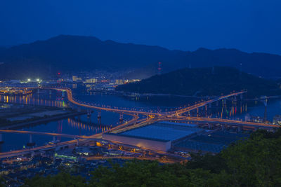 High angle view of illuminated hiroshima-shi bridge over city against sky