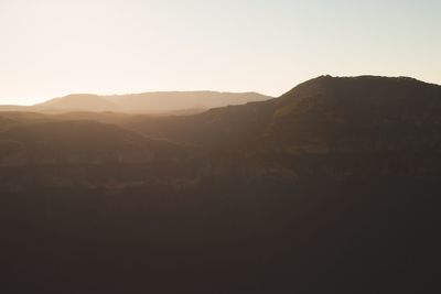 Scenic view of silhouette mountains against clear sky