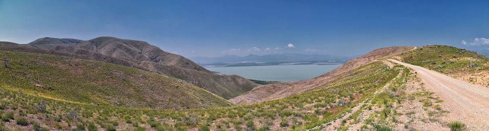 Scenic view of mountains against clear blue sky