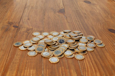 High angle view of coins on table