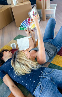 Midsection of woman sitting at home