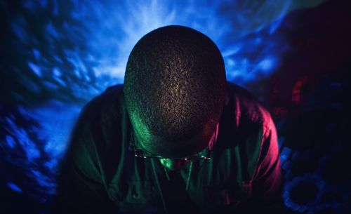 Close-up of man against moon at night