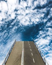 Low angle view of building against cloudy sky