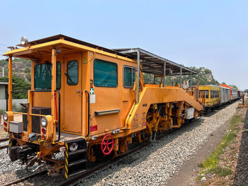 The ballast tamping machine is parking after works to maintain the sleeper and ballast stone.