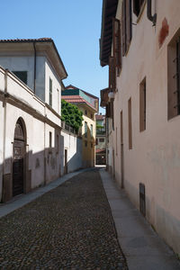 Street amidst buildings against sky