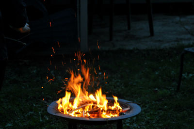 Close-up of bonfire on field at night