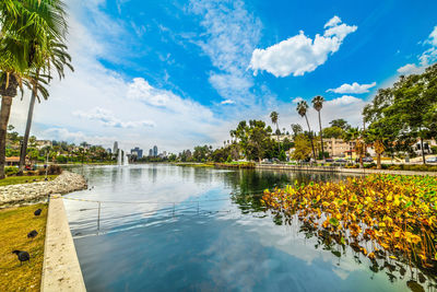 Scenic view of swimming pool by lake against sky