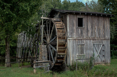 Abandoned built structure on field