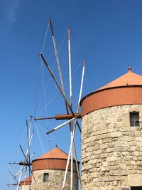 Low angle view of traditional building against clear blue sky