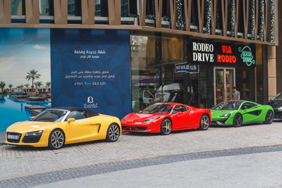 Cars on road against buildings in city